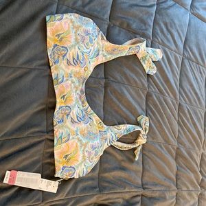 A colorful bikini top never worn size 8